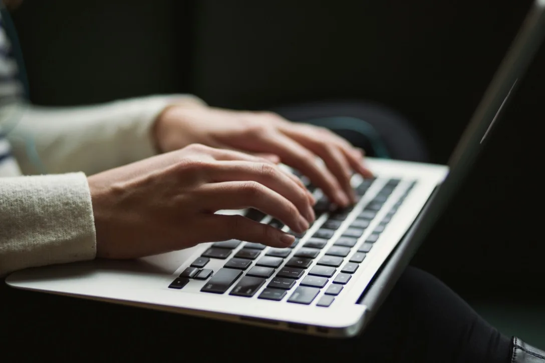 Property manager reviewing student leads on a laptop